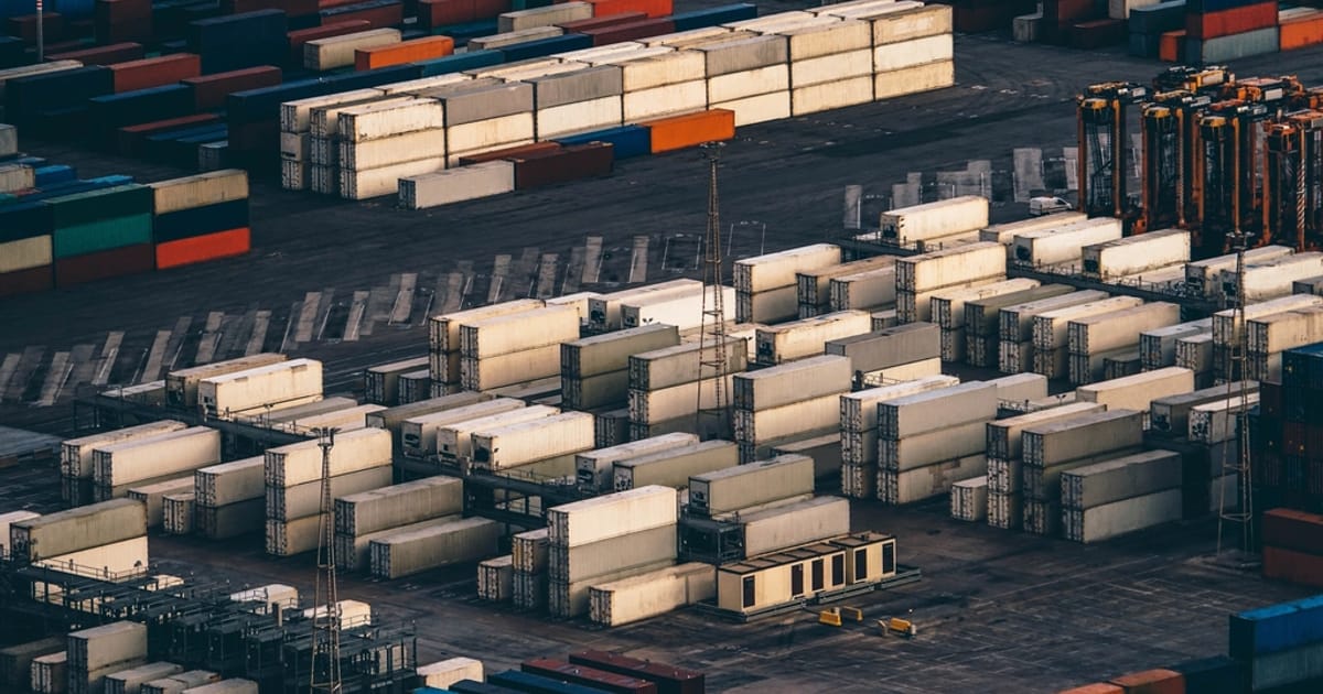 Aerial view of stacked shipping containers at a port